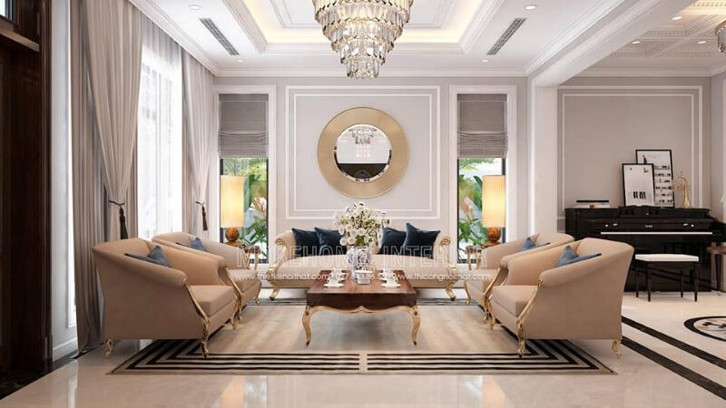 Bộ bàn ghế sofa tân cổ điển mạ vàng gam màu trắng sữa nhẹ nhàng nhưng lại tạo điểm nhấn đẹp, sang trọng cho phòng khách. Mẫu nội thất biệt thự tân cổ điển